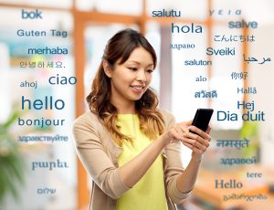 Happy asian woman using smartphone over greeting words in different foreign languages