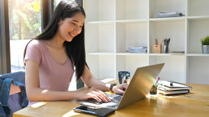 Female student working on laptop.