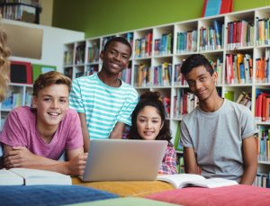 Portrait of happy students in library
